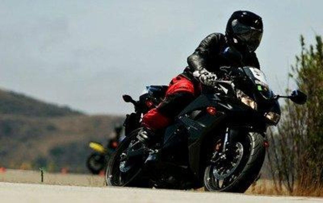 Gunnery Sgt. Craig Ranney, motorcycle president, Combat Logistics Regiment 17, 1st Marine Logistics Group, rides his motorcycle on Camp Pendleton, Calif. All Marines must attend the Basic Riders Course if they own a motorcycle or are planning on purchasing one. 