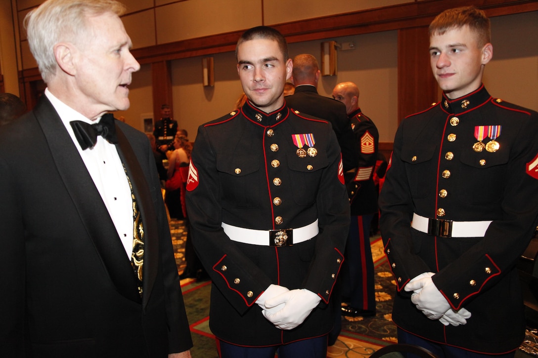 Secretary of the Navy Ray Mabus, left, talks with 2nd Marine Aircraft Wing Band trumpet players Cpl. Andrew Nesmith, center, and Lance Cpl. Joseph Decker, during the 2nd Marine Aircraft Wing birthday ball in New Bern, N.C., Nov. 7. Mabus was the guest of honor at the ball and talked about the importance of celebrating Marine history.