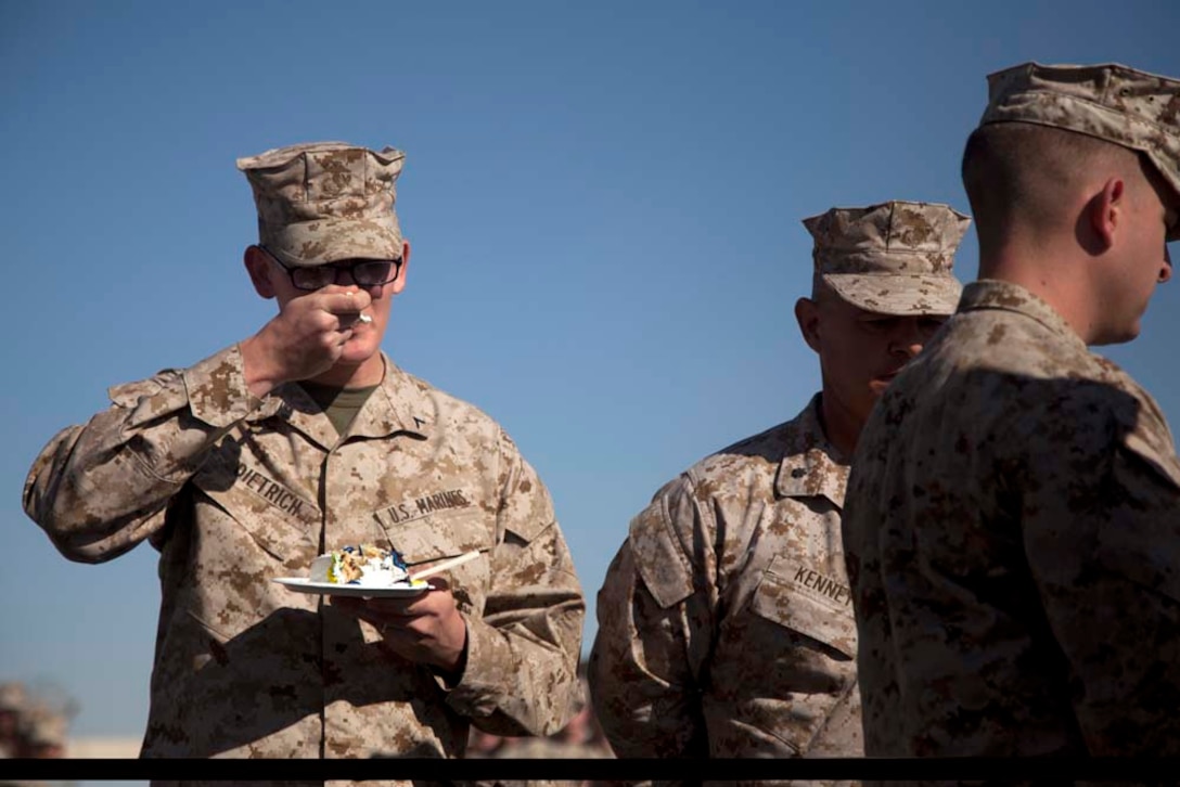 U.S. Marine Corps Pfc. Clifford C. Dietrich, Headquarters Company, Regimental Combat Team 7, the youngest Marine present, eats a piece of cake during a cake cutting ceremony on Camp Leatherneck, Helmand province, Afghanistan, Nov. 10, 2012. The ceremony was conducted in celebration of the Marine Corps 237th birthday. (U.S. Marine Corps photo by Cpl. Alejandro Pena/Released)