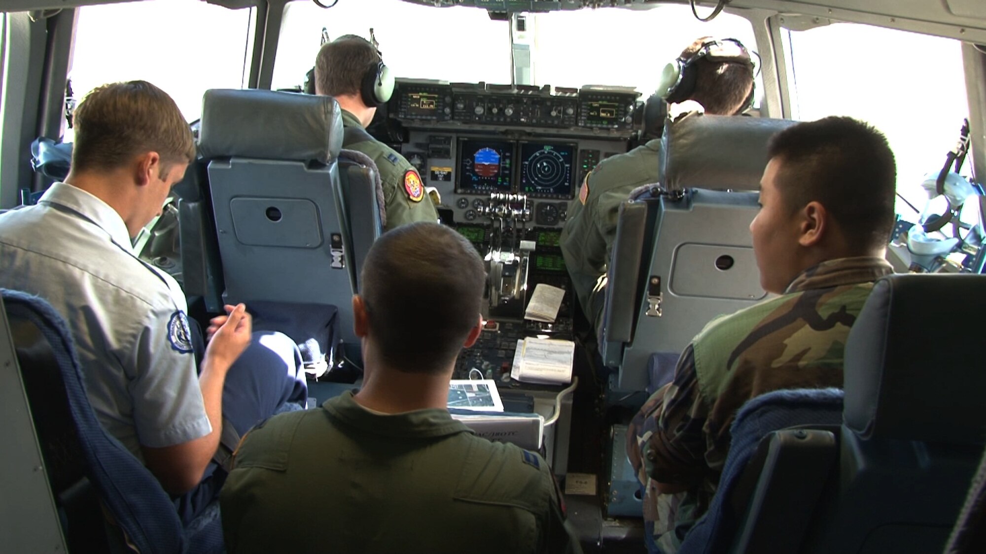 Junior Reserve Officer Training Corps cadets from six highschools around Oahu fly aboard a C-17 Globemaster III operated by an aircrew from the 535th Airlift Squadron at Joint Base Pearl Harbor-Hickam, Hawaii, Nov. 13. During the flight, 41 cadets were able to observe various C-17 capabilities such as the ability to drop "static-line" jumpers, "high-altitude, low-opening" jumpers, and the performance of an "assault" landing at Kaneohe Bay Marine Corps Base, Hawaii. (U.S. Air Force photo/ Staff Sgt. Nathan Allen)