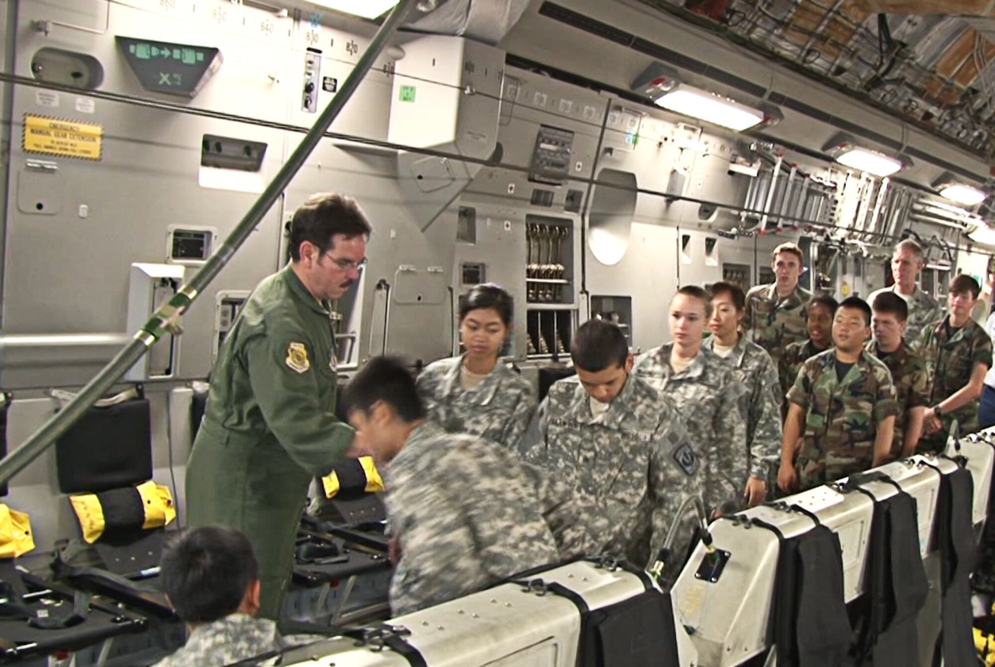 Junior Reserve Officer Training Corps cadets from six highschools around Oahu board a C-17 Globemaster III operated by an aircrew from the 535th Airlift Squadron at Joint Base Pearl Harbor-Hickam, Hawaii, Nov. 13. During the flight, 41 cadets were able to observe various C-17 capabilities such as the ability to drop "static-line" jumpers, "high-altitude, low-opening" jumpers, and the performance of an "assault" landing at Kaneohe Bay Marine Corps Base, Hawaii. (U.S. Air Force photo/ Staff Sgt. Nathan Allen)