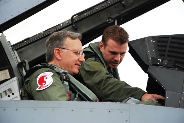 Capt. Tyler Smith, 36th Fighter Squadron pilot, shows U.S. Ambassador to Singapore David Adelman an F-16 Fighting Falcon flight display and instrumentation before flying during a combat training sortie at Paya Lebar Air Base, Oct. 19, 2012. The 36th Expeditionary Fighter Squadron deployed 77 members in support of the Joint Chiefs of Staff- directed exercise Commando Sling in October 2012 to sharpen air combat skills through combined air combat training with the Republic Singapore Air Force. (Courtesy photo) 

