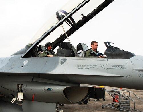 Capt. Tyler Smith, 36th Fighter Squadron pilot, prepares to fly U.S. Ambassador to Singapore David Adelman in an F-16 Fighting Falcon at Paya Lebar Air Base, Oct. 19, 2012. The flight provided Adelman a better understanding of U.S. Air Force capabilities during Operation Commando Sling 2012. (Courtesy photo) 

