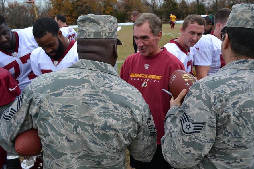 National Football League Washington Redskins Head Coach Mike Shanahan greets Air Force District of Washington Airmen during USAA?s "Salute to Service" event at the Redskins practice, Nov. 12, 2012, in Landover, Md. USAA sponsored the meet-and-greet events throughout the NFL for service members to meet players and coaches across the United States. (Courtesy photo)
