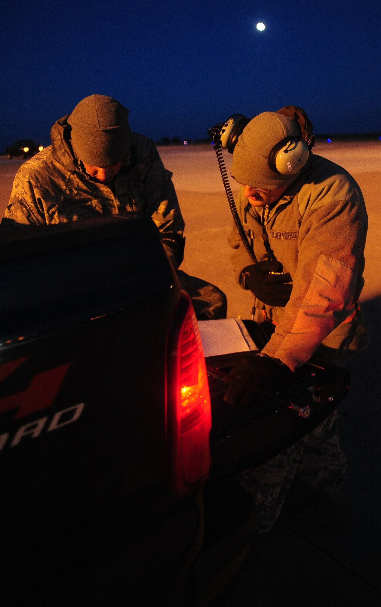 WHITEMAN AIR FORCE BASE, Mo. -- Senior Airman Brian Schroeder, 509th Aircraft Maintenance Squadron dedicated crew chief, and Tech. Sgt. Jonathan Cates, 509th AMXS assistant section chief, review aircraft forms Oct. 28. Maintainers perform preventative maintenance, pre- and post-flight inspections, and maintain and repair the aircraft, inside and out with the responsibility of ensuring all aspects of the B-2 Spirit are in working order. (U.S. Air Force photo/Senior Airman Nick Wilson) (Released)