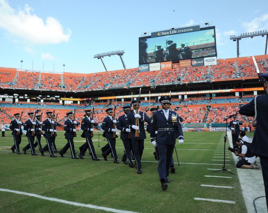 Master Sgt. Whitfield Jack, the Drill Team's flight chief, leads the team, off the feild after their performance Nov. 11, 2012. (U.S. Air Force photo/Staff Sgt. Torey Griffith)