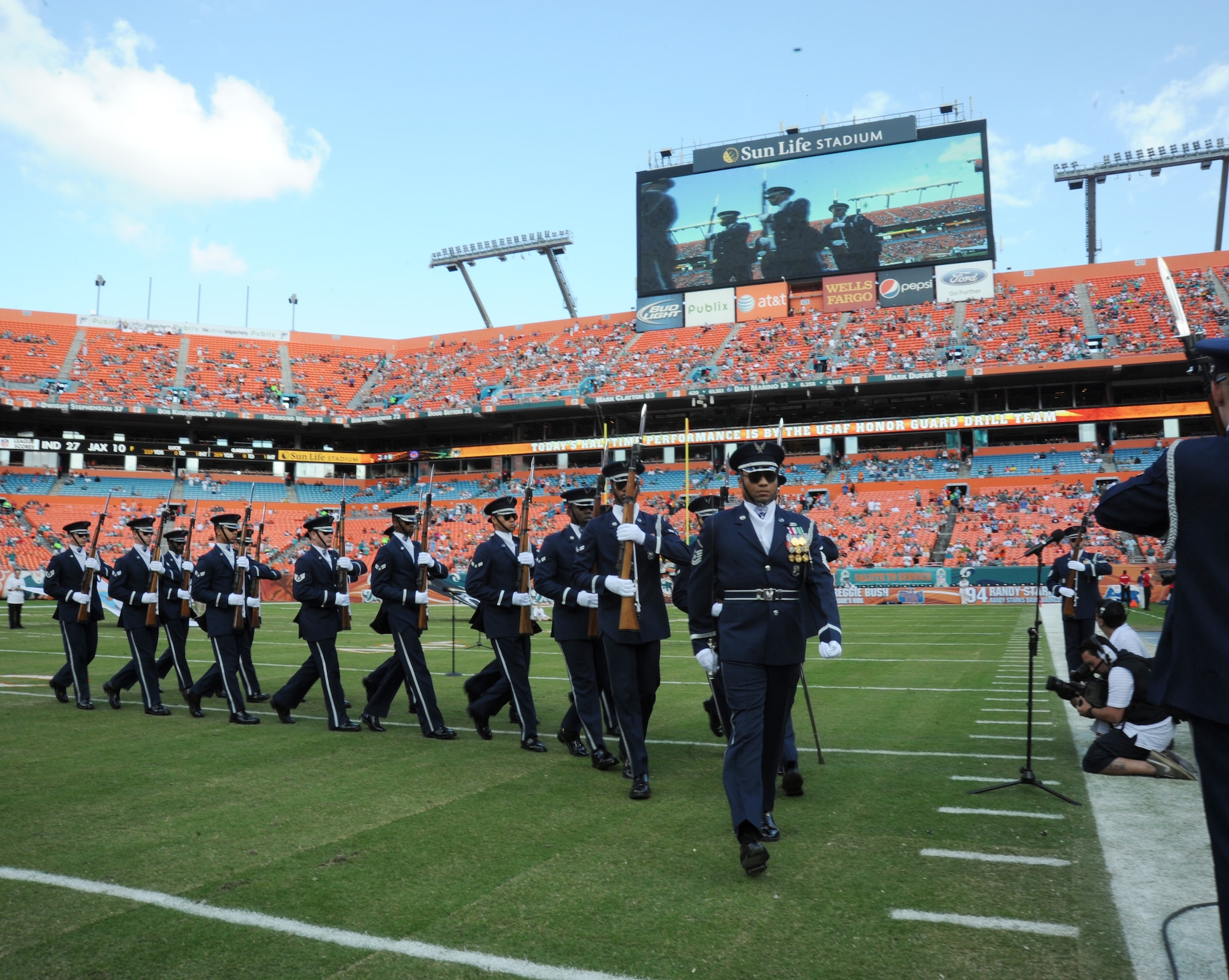 Master Sgt. Whitfield Jack, the Drill Team's flight chief, leads the team, off the feild after their performance Nov. 11, 2012. (U.S. Air Force photo/Staff Sgt. Torey Griffith)