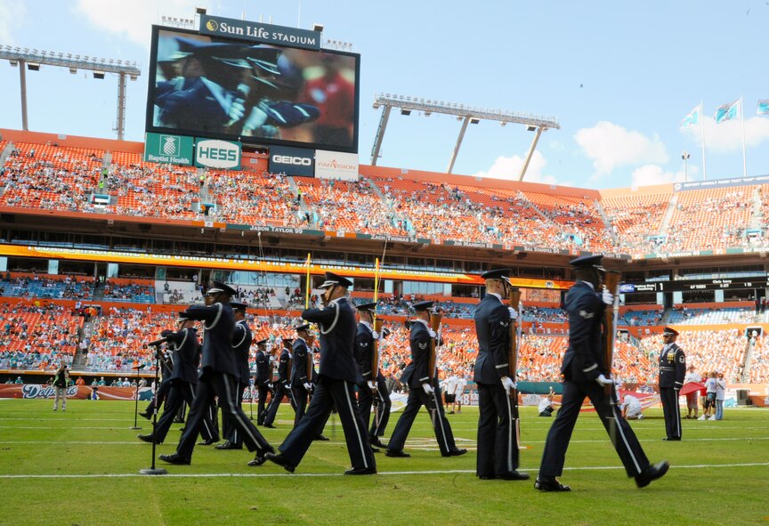 Members of the U.S. Air Force Honor Guard Drill Team perfom at the Miami Dolphins "Salute to Service" halftime show Nov. 11, 2012, in Miami.  The Veteran's Day tribute honored veterans of military service both past and present.  (U.S. Air Force photo/Staff Sgt. Torey Griffith)