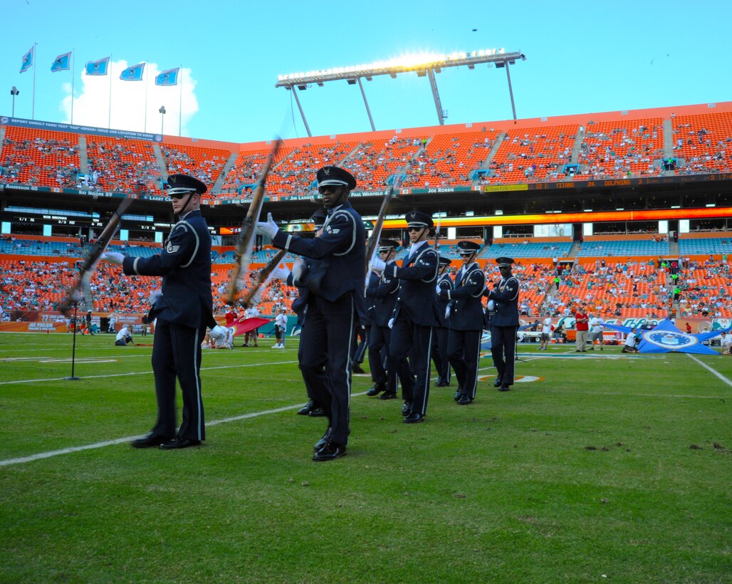 Members of the U.S. Air Force Honor Guard Drill Team perfom at the Miami Dolphins "Salute to Service" halftime show Nov. 11, 2012, in Miami.  The Veteran's Day tribute honored veterans of military service both past and present.  (U.S. Air Force photo/Staff Sgt. Torey Griffith)