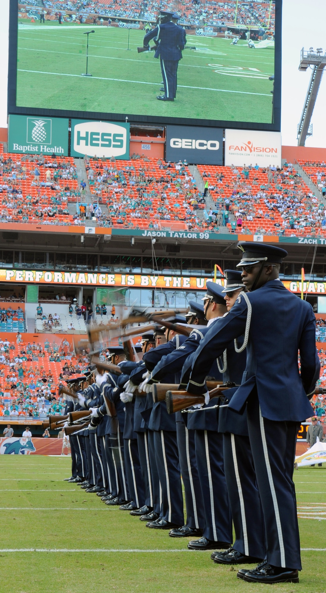 Members of the U.S. Air Force Honor Guard Drill Team spin their M-1 rifles up and down "The Line" at the Miami Dolphins "Salute to Service" halftime show Nov. 11, 2012, in Miami.  The Veteran's Day tribute honored veterans of military service both past and present.  (U.S. Air Force photo/Staff Sgt. Torey Griffith)