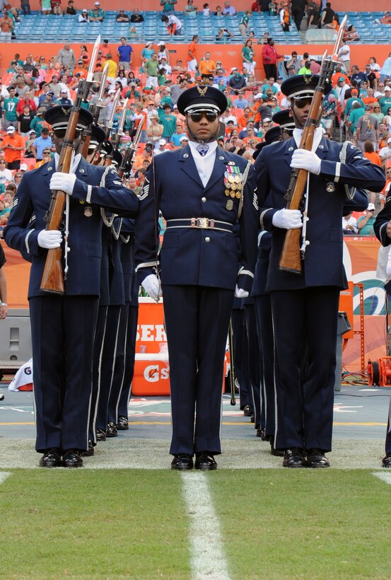 Members of the U.S. Air Force Honor Guard Drill Team prepare to march onto the field to perfom at the Miami Dolphins "Salute to Service" halftime show Nov. 11, 2012, in Miami.  The Veteran's Day tribute honored veterans of military service both past and present.  (U.S. Air Force photo/Staff Sgt. Torey Griffith)