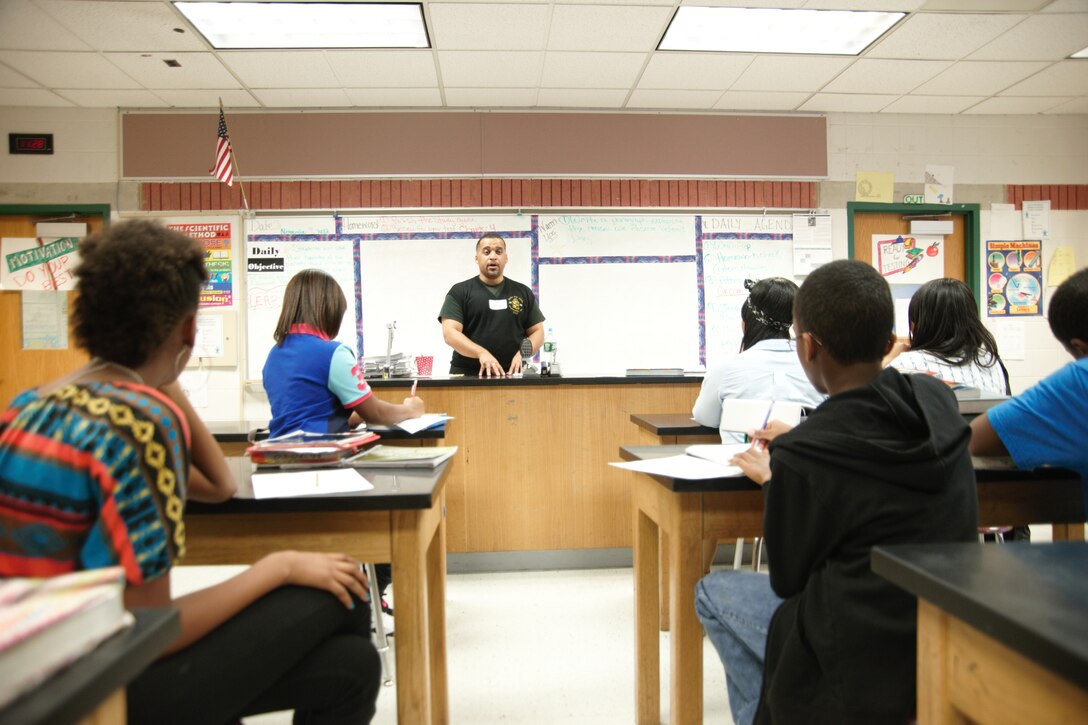 WALDORF, Md. - Retired Capt. Timothy Boykin holds an in depth conversation about his military experience at Mattawoman Middle Schools' Veterans Day program, Nov. 9, 2012.  Veterans spoke with nearly 150 students at the annual event. (U.S. Air Force photo/ Senior Airman Amber Russell)