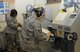 Tech. Sgt. Amy Touchette and Staff Sgt. Maria Cook, prepare to sand arch support inserts, Oct. 9 at the David Grant Medical Center brace shop. (US Air Force photo/Staff Sgt. Liliana Moreno)