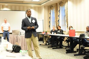 WALDORF, Md. - Chaplain Capt. Denis Gueu, head chaplain, and Master Sgt. Matt Cagle, 744th Communication Squadron NCO in charge of cable maintenance, host a chapel sponsored singles retreat at Bolger Center Resort in Potomac, Md., Oct. 12-14, 2012. The retreat served to promote healthy and successful communication in male and female relationships. (U.S. Air Force photo/ Senior Airman Amber Russell)
