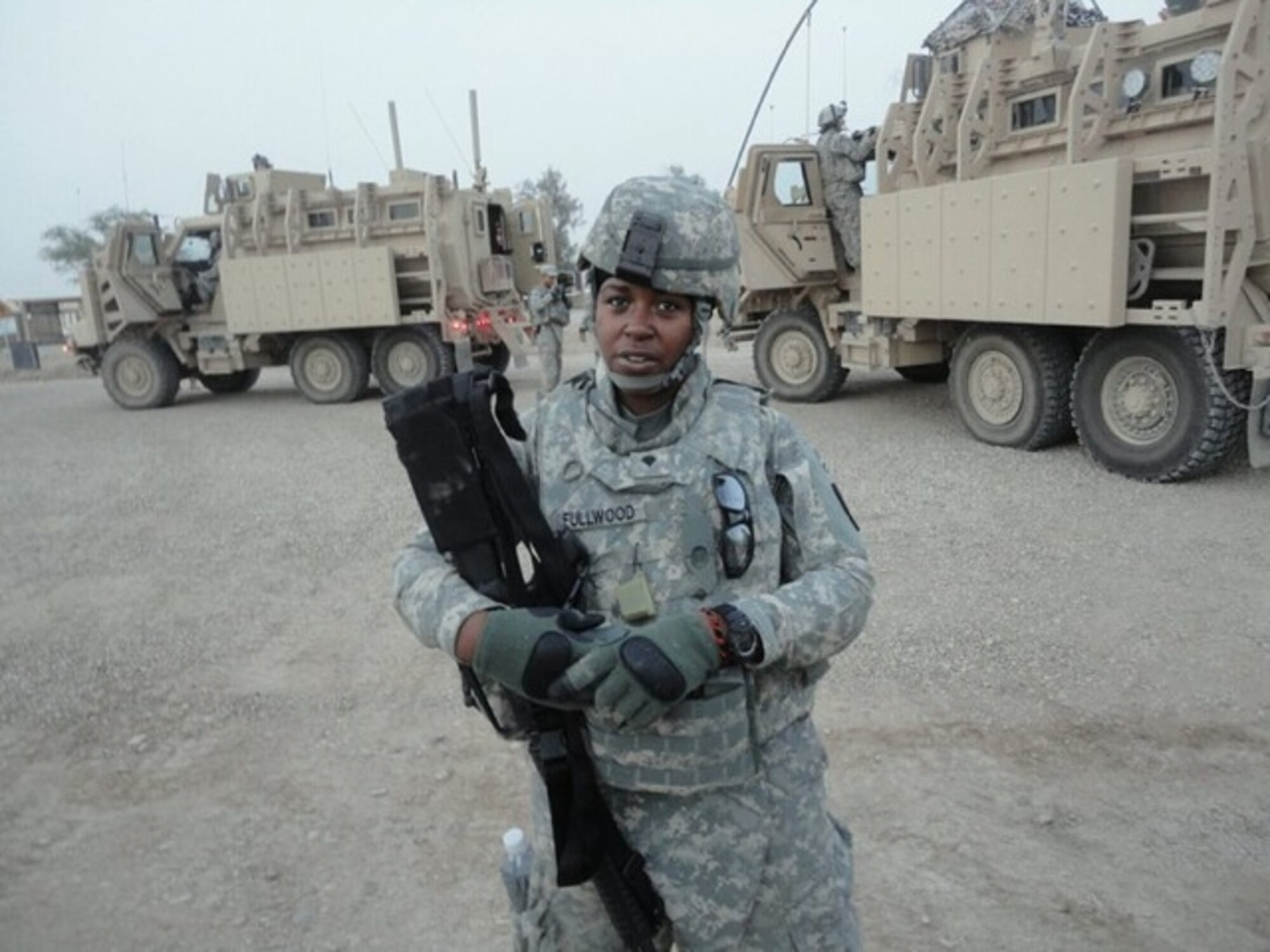 During a Joint-base Balad Chaplain Unit ministry tour “Operation New Dawn.” Sgt. LaRita Fullwood, 7th Sustainment Brigade chaplain assistant noncommissioned officer in charge, stands outside a convoy with her M-16 at the Ziggurat in Ur, Iraq. This was the unit’s last tour prior to base closure. (U.S. Army courtesy photo/Released)