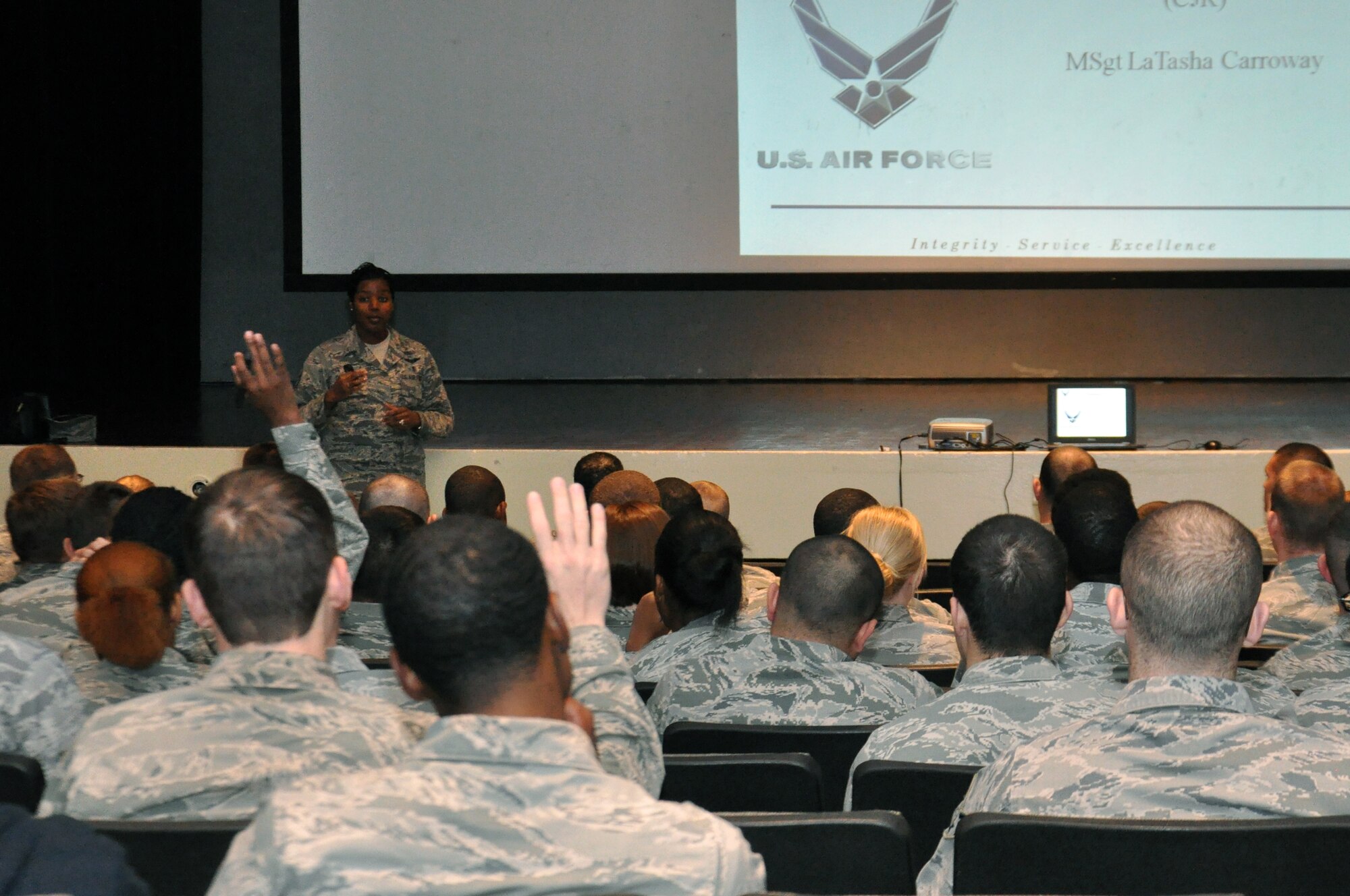 U.S. Air Force Master Sgt. LaTasha Carroway, 4th Fighter Wing Career Advisor, asks for questions during a briefing at the base theater on Seymour Johnson Air Force Base, N.C., Nov. 14, 2012. The briefing was held to inform first-term Airmen who’s Air Force specialty codes are on a constrained AFSC list of their options when it comes to reenlisting. (U.S. Air Force photo/Airman1st Class Mariah Tolbert/Released)