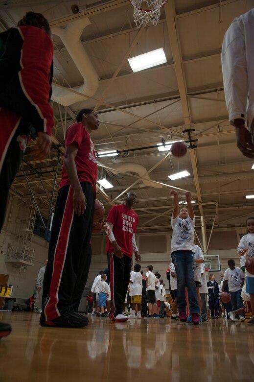 Mollie Foster, daughter of Staff Sgt. Linda Foster, 628th Logistics Readiness Squadron, practices her shot during a Hoops from Home Clinic Nov. 8, 2012, at Joint Base Charleston - Air Base, S.C. Hoops from Home is a non-profit organization providing a basketball camp/clinic experience to the children of military families across the world. It provides the children with an opportunity to work with players and coaches and highlight the benefits of team sports, physical activity and commitment. (U.S. Air Force photo/Airman 1st Class Ashlee Galloway)