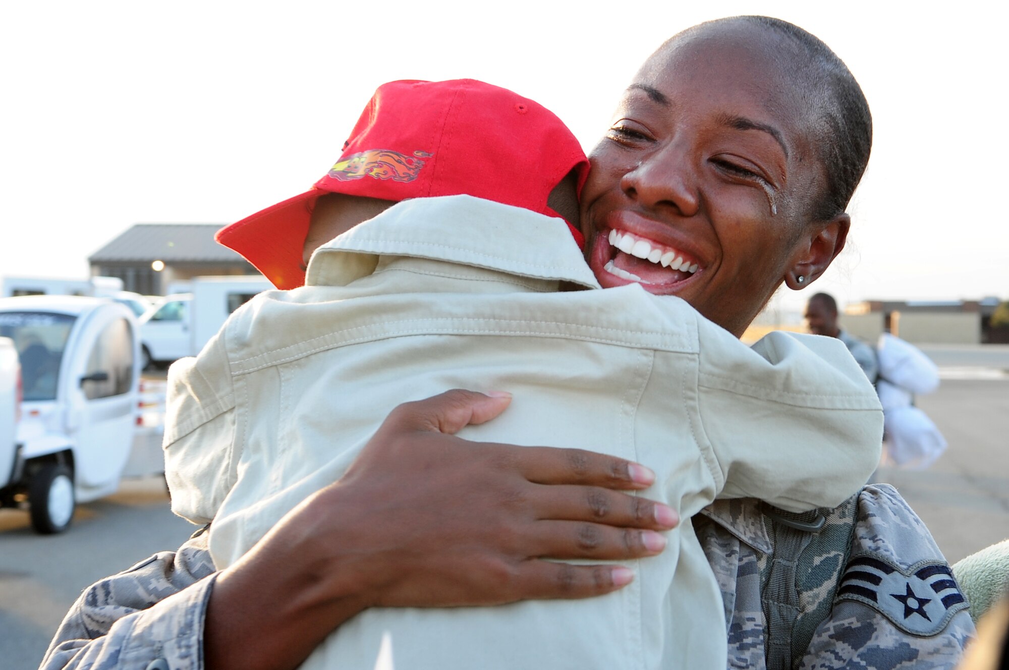 U.S. Air Force Senior Airman Kimberly McAllister, 4th Equipment Maintenance Squadron, cries as she hugs her son, Kilan McAllister, 3, at a deployment return on Seymour Johnson Air Force Base, N.C., Nov. 14, 2012. McAllister was deployed to the Middle East for six months. (U.S. Air Force photo/Airman 1st Class Aubrey White/Released)