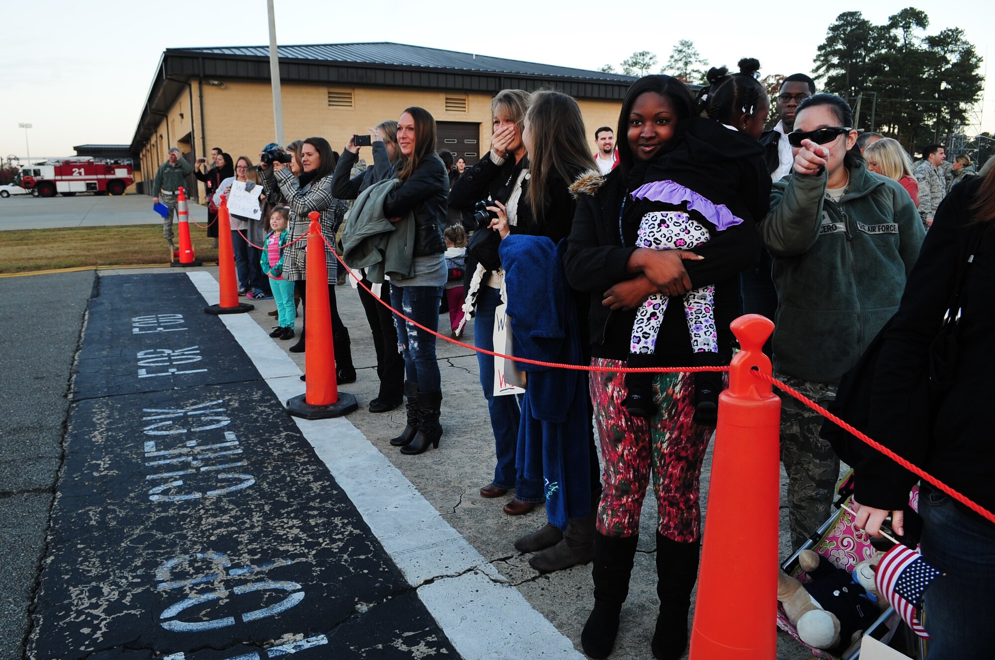 Members of Team Seymour watch as U.S. Air Force Airmen assigned to the 4th Fighter Wing return from a deployment, on Seymour Johnson Air Force Base, N.C., Nov. 14, 2012. Families and friends welcomed approximately 150 Airmen after a six-month deployment to the Middle East. (U.S. Air Force photo/Airman 1st Class Aubrey White/Released)