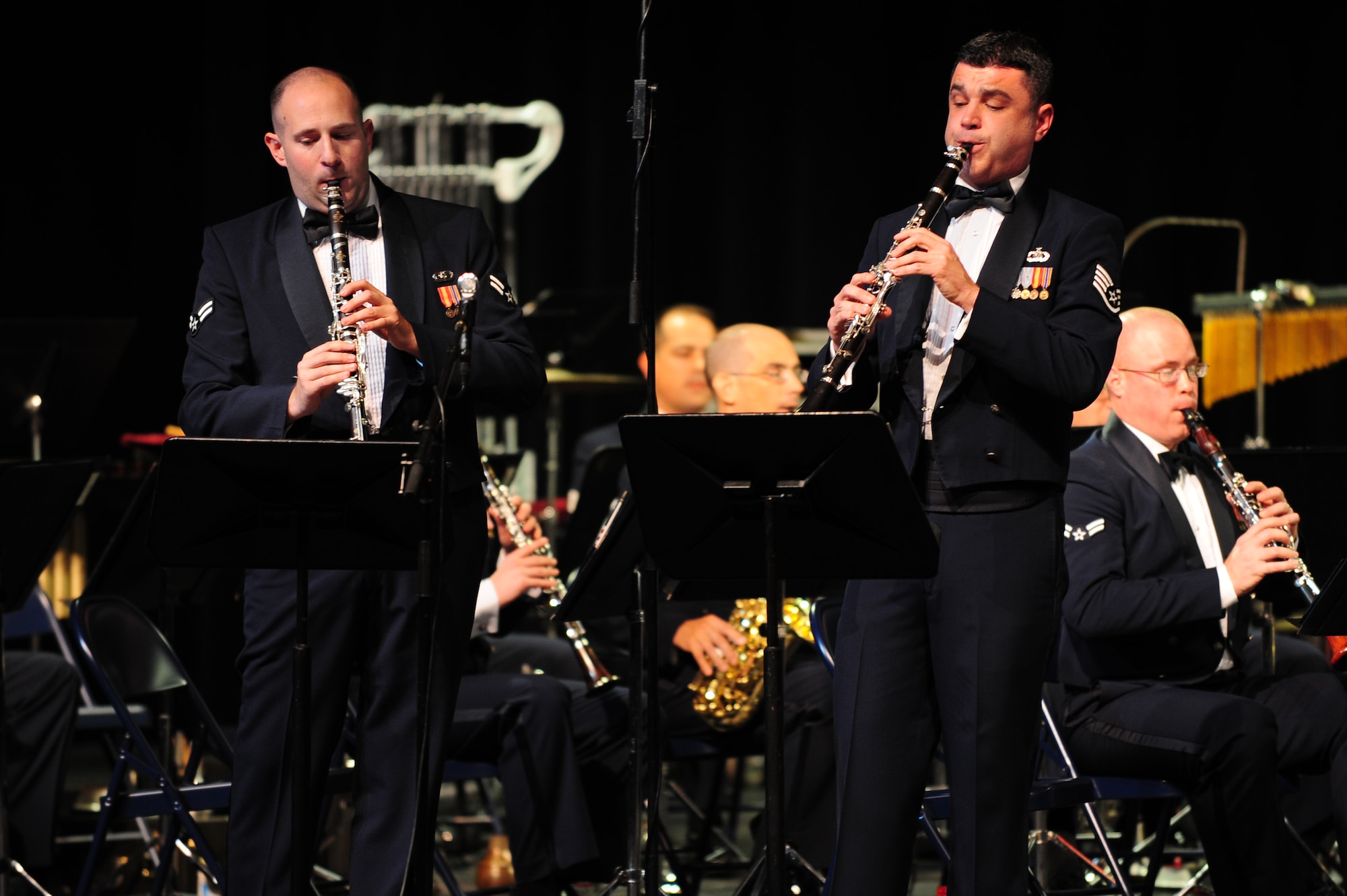 U.S. Air Force Airman 1st Class David Halperin and Staff Sgt. Jeffrey Boehmer, U.S. Air Force Heritage of America Band clarinetists, perform a duet during a concert at Jesse Carson High School in China Grove, N.C., Nov. 9, 2012. The band plays a variety of jazz, classical and patriotic music for audience members, to include veterans, retirees and their families. Halperin hails from Illinois and Boehmer is a native of Maryland. (U.S. Air Force photo/Airman 1st Class Aubrey White/Released)