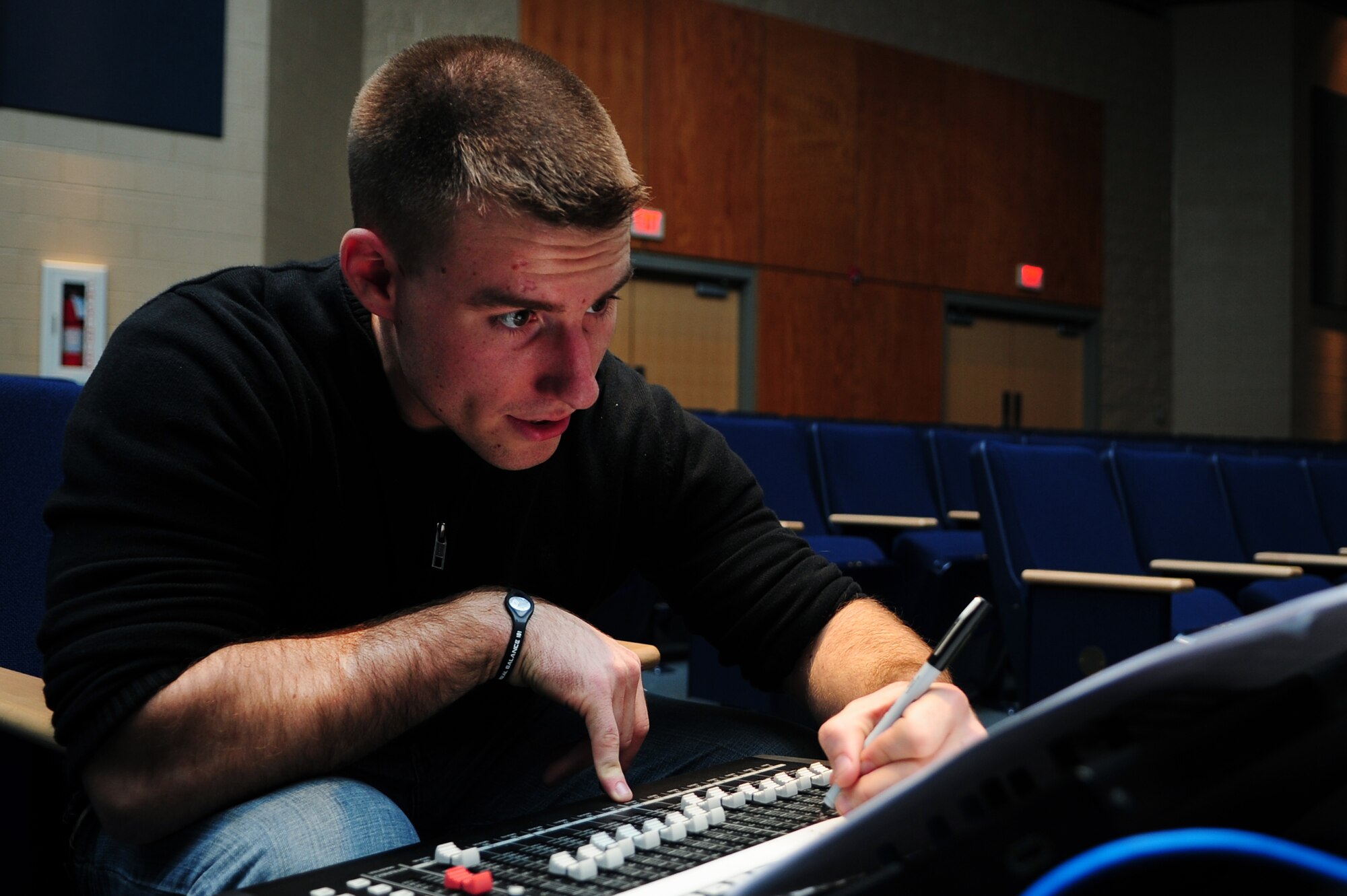 U.S. Air Force Senior Airman William Anger, U.S. Air Force Heritage of America Band audio engineer, labels a sound board prior to the band’s sound check at Jesse Carson High School in China Grove, N.C., Nov. 9, 2012. Anger, along with another Airman, helps to ensure the band’s microphones and speakers work properly. Anger hails from Colorado.(U.S. Air Force photo/Airman 1st Class Aubrey White/Released)