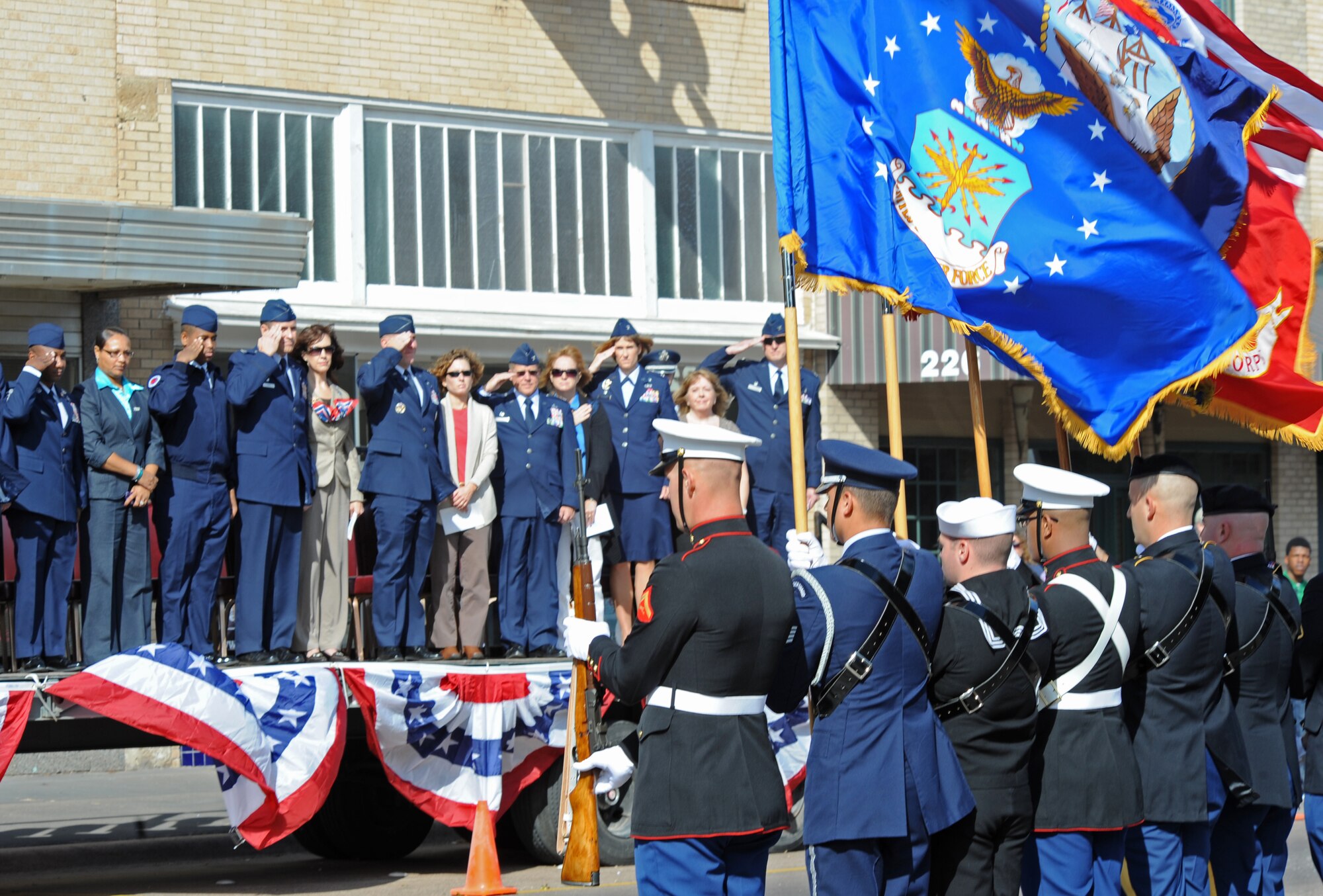 The color guard presents the colors Nov. 10, 2012, in Abilene, Texas. Dyess Air Force Base Airmen marched alongside local Junior Reserve Officers’ Training Corps cadets and marching bands in Abilene's annual parade to commemorate the service military members provide to the United States. (U.S. Air Force photo by Airman 1st Class Peter Thompson/ Released) 