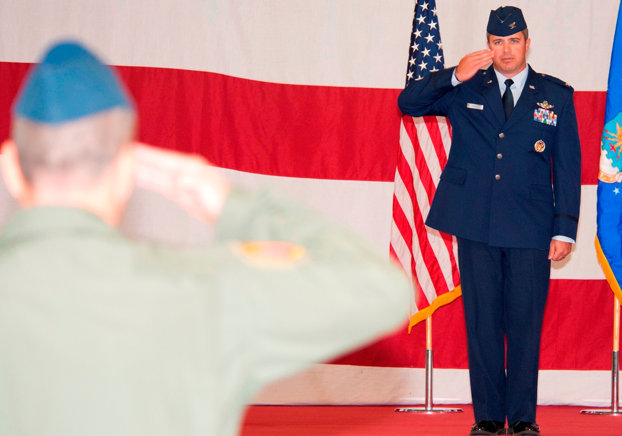Col. David Graff, 325th Fighter Wing commander, executes his first salute as commander during the wing change of command ceremony Nov. 14 in Hangar 1. (U.S. Air Force photo by Lisa Norman)
