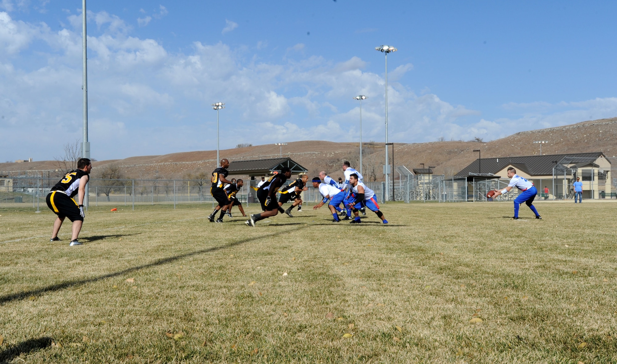 The fourth annual flag football game between McConnell Air Force Base, Kan., and Fort Riley was held Nov. 10, 2012, Fort Riley, Kan. The McConnell Tornadoes were defeated 12-18, forcing them to hand over the traveling trophy to the Soldiers for the third time since the competition began in 2009. (U.S. Air Force photo/Senior Airman Laura L. Valentine)