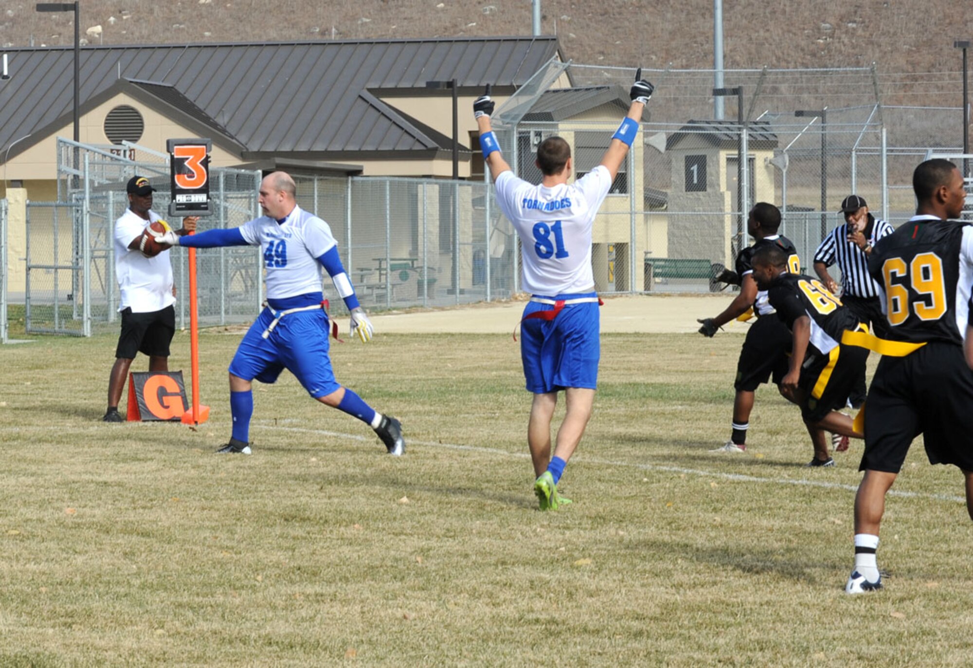 Airman 1st Class Seth Corliss, 350th Air Refueling Squadron boom operator, scores a touchdown during the second quarter against the Soldiers of Fort Riley Nov. 10, 2012, Fort Riley, Kan. McConnell and Fort Riley competed in the fourth annual flag football game for year-long rights to the traveling trophy. (U.S. Air Force photo/Senior Airman Laura L. Valentine)
