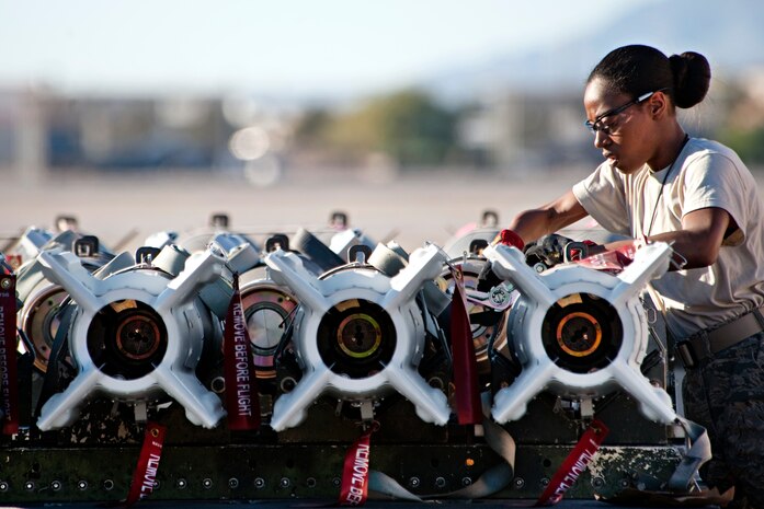 Airman 1st Class Shakera Whatley, 187th Maintenance Squadron munitions journeyman, Alabama Air National Guard, prepares to load armament onto an F-16 Fighting Falcon during the Green Flag exercise Oct. 29, 2012, at Nellis AFB, Nev. Green Flag-West is a realistic air-land integration combat training exercise held at US Army Combat Training Center at Ft. Irwin, Calif. (U.S. Air Force photo by Lawrence Crespo)

