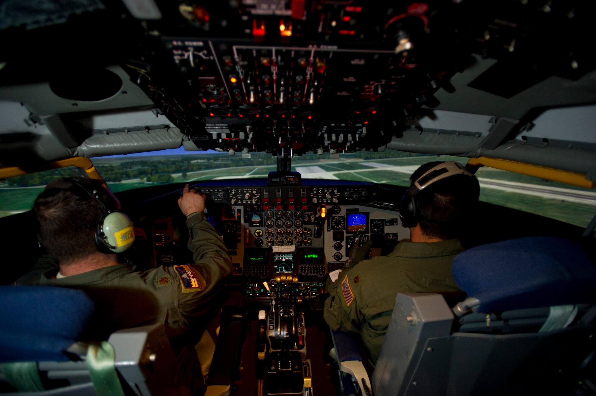 Pilots from McConnell complete a training session on the updated KC-135 Stratotanker simulator Nov. 13, 2012, McConnell Air Force Base, Kan. The simulator was updated with high definition graphics in order to increase the realistic feeling of simulated flight.(U.S. Air Force photo/ Senior Airman Armando A. Schwier-Morales)