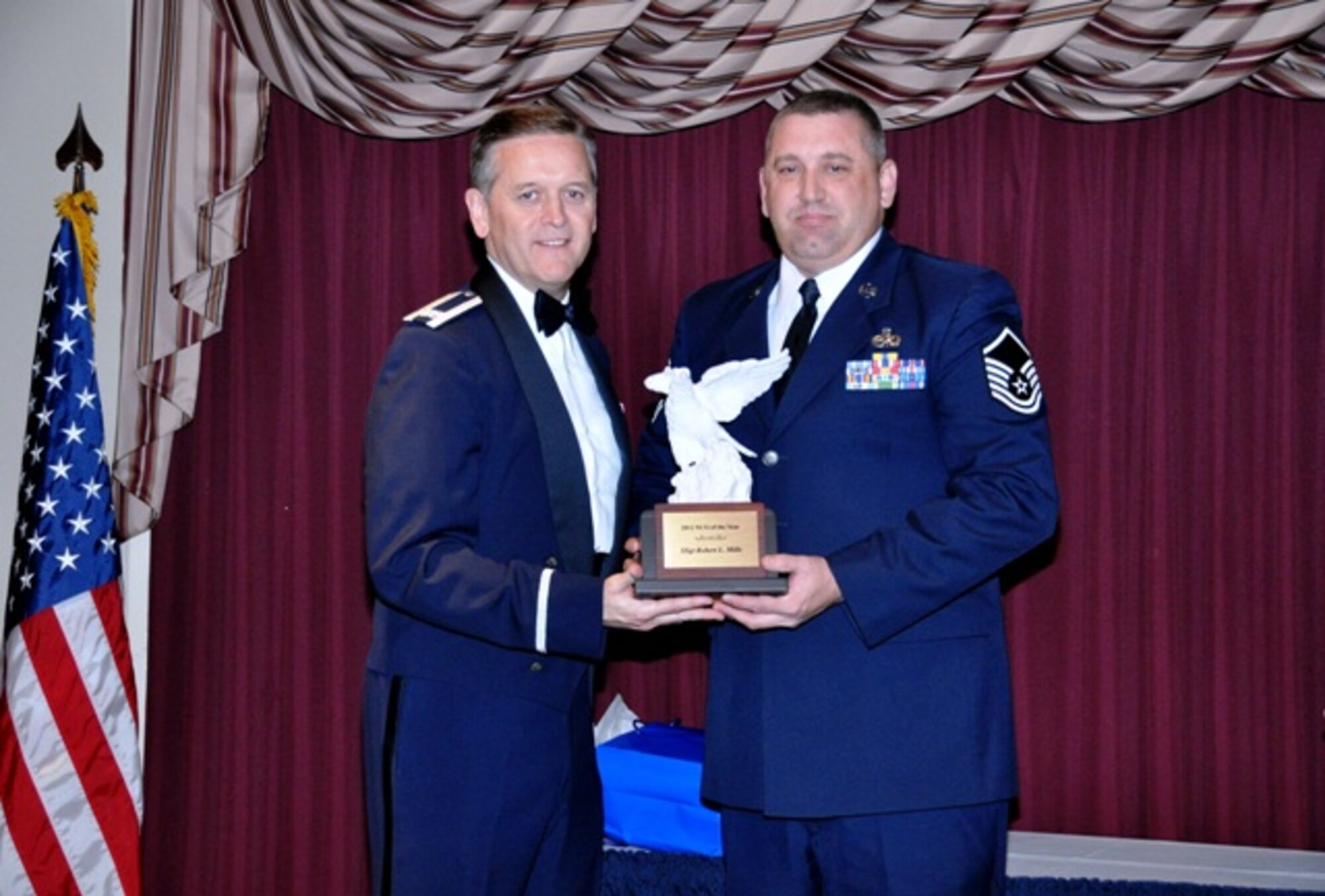 507th Air Refueling Wing

11/14/2012 – TINKER AIR FORCE BASE, Okla. – Master Sergeant Travis S. Fowler accepts the Non Commissioned Officer of the Year Award for Staff Sergeant Robert L. Mills of the 507th Maintenance Group.  The award was received at the Annual Awards Ceremony held on base recently as family, friends and guests from the 507th celebrated all the nominees and winners.  
