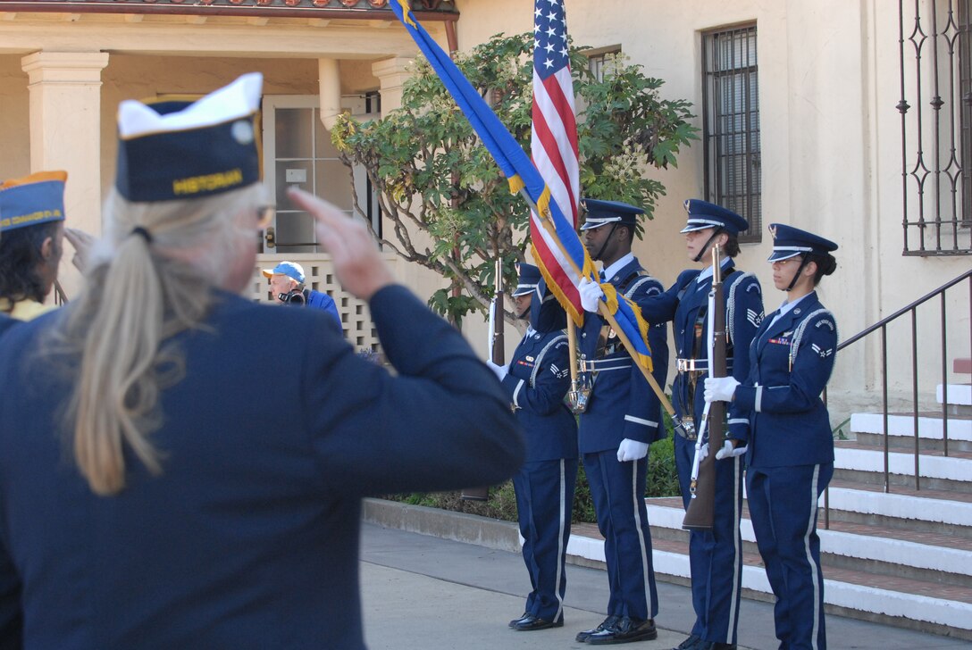 VANDENBERG AIR FORCE BASE, Calif. -- Military veterans salute as Vandenberg Honor Guard members post the colors during a Veteran's Day ceremony in Lompoc Sunday, Nov. 11, 2012. Vandenberg senior leaders partnered with local veterans groups and community leaders to speak during Veteran's Day events and offer their gratitude on behalf of active duty military to all veterans who have served their country. (U.S. Air Force photo/Master Sgt. John Peters)