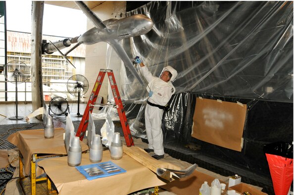 Marvin Sellers, a senior engineer with ATA’s Flight Systems Testing group, applies the base layer of Pressure Sensitive Paint (PSP) on a scale model of the Air Force’s C-5M Galaxy in AEDC’s 16-foot transonic wind tunnel prior to aerodynamic testing to validate two winglets with the goal of reducing drag, improving fuel efficiency and lowering operating costs. (Photo by Rick Goodfriend)