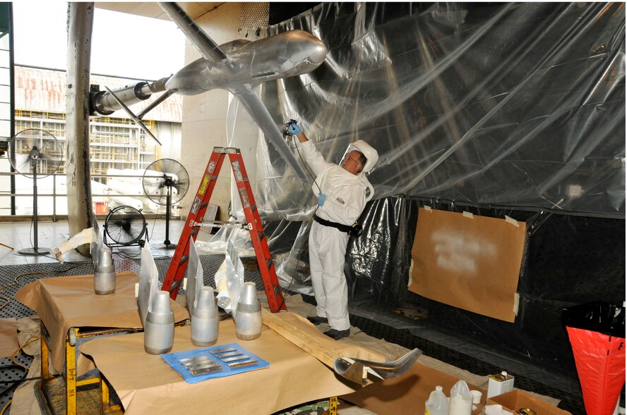 Marvin Sellers, a senior engineer with ATA’s Flight Systems Testing group, applies the base layer of Pressure Sensitive Paint on a scale model of the Air Force’s C-5M Super Galaxy in AEDC’s 16-foot transonic wind tunnel prior to aerodynamic testing to validate two winglets with the goal of reducing drag, improving fuel efficiency and lowering operating costs. (U.S. Air Force photo/Rick Goodfriend) 