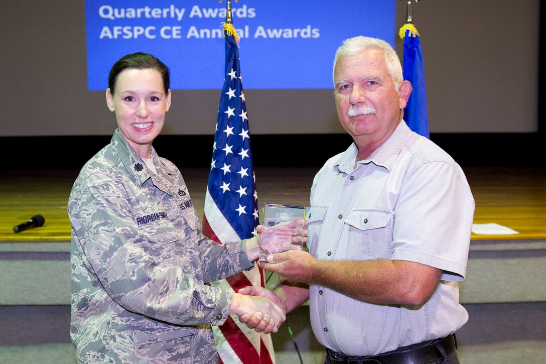 Lt. Col. Susan Riordan-Smith, commander, 45th Civil Engineer Squadron, presents the Category I Supervisory Civilian of the Quarter Award to Mr. Kenneth Wilant.