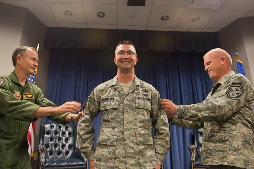 U.S. Air Force Staff Sgt. Michael Youngblood, 23d Force Support Squadron Senior Airman Jason D. Cunningham Airman Leadership School instructor, receives technical sergeant stripes from Col. Billy Thompson, 23d Wing commander, and Chief Master Sgt. Frank Batten, 23d WG command chief, during a surprise promotion under the Stripes for Exceptional Performers program Nov. 14, 2012, at Moody Air Force Base, Ga. (U.S. Air Force photo by Staff Sgt. Jamal D. Sutter/Released)  