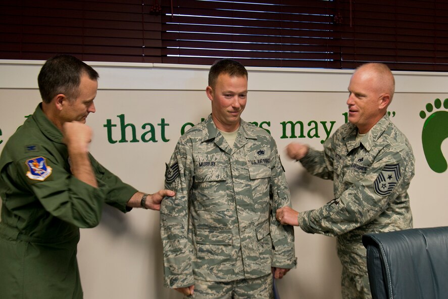 U.S. Air Force Staff Sgt. Cody Murray, 23d Maintenance Group HH-60 quality assurance inspector, receives technical sergeant stripes from Col. Billy Thompson, 23d Wing commander, and Chief Master Sgt. Frank Batten, 23d WG command chief, during a surprise promotion under the Stripes for Exceptional Performers program Nov. 13, 2012, at Moody Air Force Base, Ga. Murray did not feel well that morning and wasn’t going to make it to his unit’s staff meeting, but when he received grief from his leadership for not being there, he showed up to be notified of his new rank. (U.S. Air Force photo by Staff Sgt. Jamal D. Sutter/Released)
