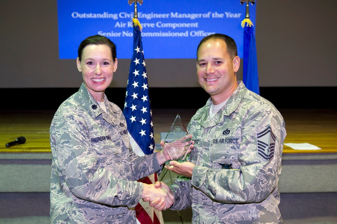 Senior Master Sgt. Terry Wooldridge is awarded the Outstanding CE Manager of the Year, ARC SNCO Category.