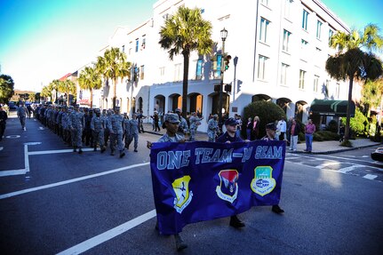 Airmen and Sailors march during the Veterans Day Parade Nov. 10, 2012, in downtown Charleston, S.C. More than a hundred Airmen and Sailors from Joint Base Charleston marched in the parade, which traveled through the streets of historic downtown Charleston. The parade kicked off with the playing of the National Anthem and a fly-over by a JB Charleston C-17 Globemaster III.  The parade was sponsored by the Ralph H. Johnson VA Medical Center and featured historic military vehicles, motorcycle groups and veterans’ service organization floats. (U.S. Air Force photo/Staff Sgt. Rasheen Douglas)