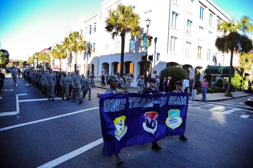 Airmen and Sailors march during the Veterans Day Parade Nov. 10, 2012, in downtown Charleston, S.C. More than a hundred Airmen and Sailors from Joint Base Charleston marched in the parade, which traveled through the streets of historic downtown Charleston. The parade kicked off with the playing of the National Anthem and a fly-over by a JB Charleston C-17 Globemaster III.  The parade was sponsored by the Ralph H. Johnson VA Medical Center and featured historic military vehicles, motorcycle groups and veterans’ service organization floats. (U.S. Air Force photo/Staff Sgt. Rasheen Douglas)