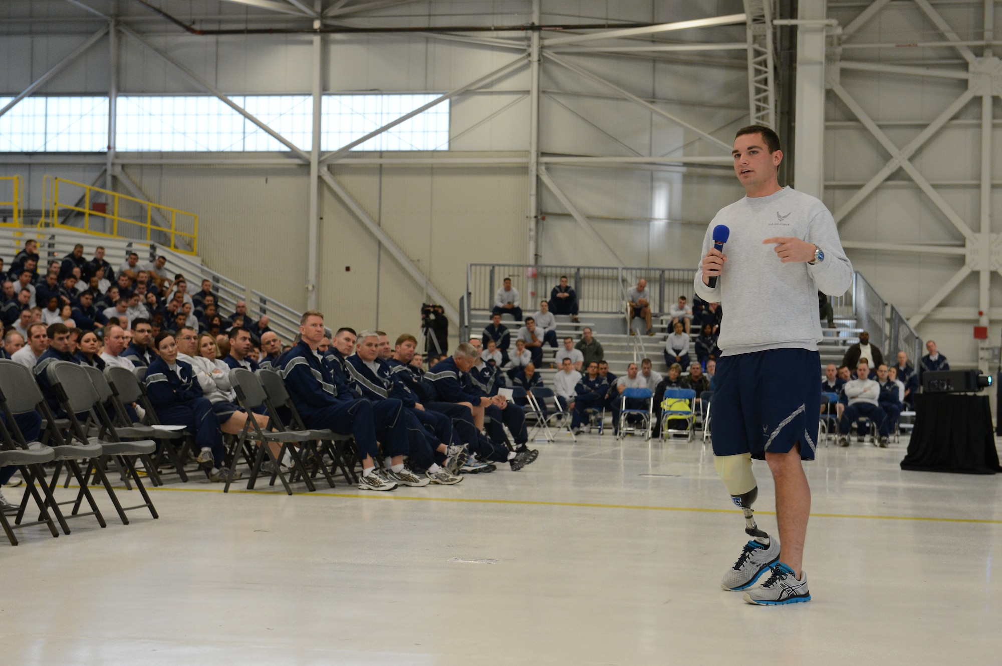 Capt. Ryan McGuire, 4th Airlift Squadron executive officer, speaks about overcoming adversity and adapting, Nov. 9, 2012, during Wingman Day at Joint Base Lewis-McChord, Wash. McGuire, who lost his leg during a boating accident, managed to overcome his adversity and finish pilot training, despite being told by doctors that it would be virtually impossible to remain in the Air Force. (U.S. Air Force photo/Staff Sgt. Sean Tobin)