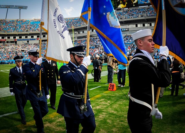 The Joint Base Charleston Honor Guard team marches off the field at the Carolina Panthers - Denver Broncos football game Nov. 11, 2012, at the Bank of America Stadium, Charlotte, N.C. The team was tasked to present the Colors during the Panthers annual Military Appreciation Day. (U.S. Air Force photo/Staff Sgt. Anthony Hyatt)