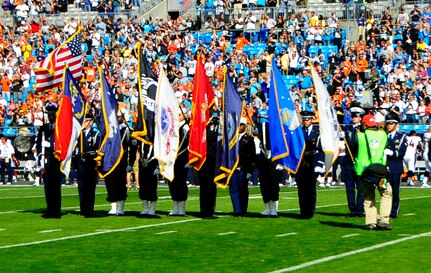 Members of Joint Base Charleston’s Honor Guard present the colors during the Carolina Panthers and Denver Broncos pre-game ceremony Nov. 11, 2012, at the Bank of America Stadium in Charlotte, N.C. The Carolina Panthers hosted active duty and retired members of the military in recognition of Veterans Day. (U.S. Air Force photo/Senior Airman Ian Hoachlander)