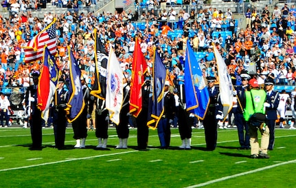 Members of Joint Base Charleston’s Honor Guard present the colors during the Carolina Panthers and Denver Broncos pre-game ceremony Nov. 11, 2012, at the Bank of America Stadium in Charlotte, N.C. The Carolina Panthers hosted active duty and retired members of the military in recognition of Veterans Day. (U.S. Air Force photo/Senior Airman Ian Hoachlander)