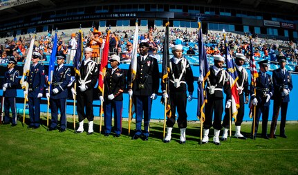 Joint Base Charleston’s Honor Guard team prepares to present the Colors before the Carolina Panthers - Denver Broncos football game Nov. 11, 2012, at Bank of America Stadium, Charlotte, N.C. More than 74,000 fans were in attendance for the game. (U.S. Air Force photo/Staff Sgt. Anthony Hyatt)