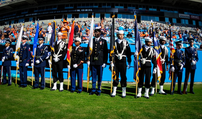 Joint Base Charleston’s Honor Guard team prepares to present the Colors before the Carolina Panthers - Denver Broncos football game Nov. 11, 2012, at Bank of America Stadium, Charlotte, N.C. More than 74,000 fans were in attendance for the game. (U.S. Air Force photo/Staff Sgt. Anthony Hyatt)