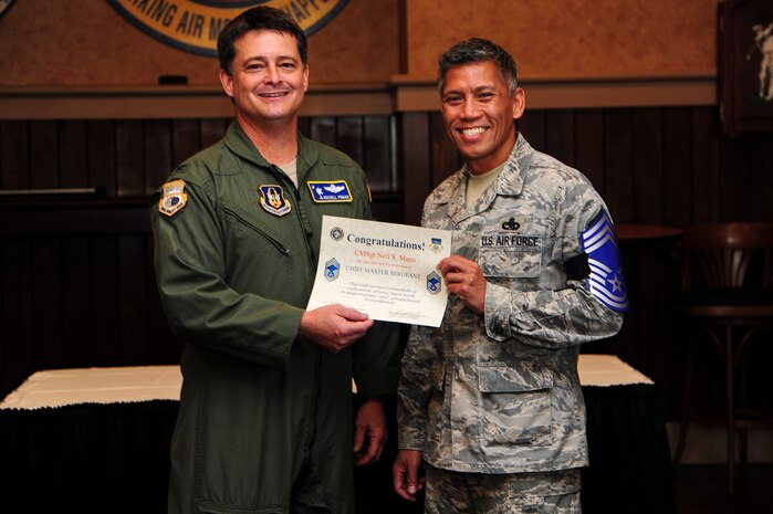 Col. Russell Fingar, 315th Airlift Wing vice commander, presents a certificate of promotion to Senior Master Sgt. Neil Mann, 315th Maintenance Squadron fabrications flight chief, at the Charleston Club Nov. 9, 2012, on Joint Base Charleston – Air Base, S.C. The Air Force has released the list of 454 senior master sergeants selected for promotion to chief master sergeant. The new E-9s were selected by an evaluation board that met in October and will join the ranks of less than one percent of the service’s enlisted force. The senior noncommissioned officers who made the cut this year were selected from a pool of 1,981 eligible senior master sergeants. (U.S. Air Force photo/Staff Sgt. Rasheen Douglas)