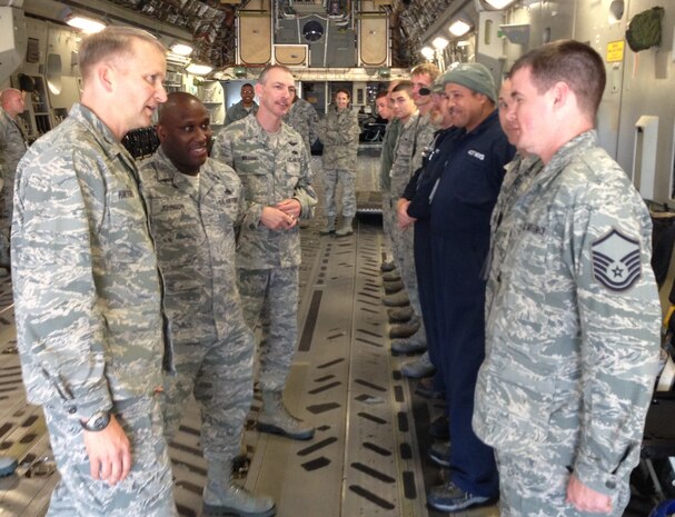 Col. Darren Hartford, 437th Airlift Wing commander, and Chief Master Sgt. Larry Williams (third from left) recognize a group of 20 maintainers from the 437th Aircraft Maintenance Squadron, 437th Maintenance Squadron and Boeing engineers inside a C-17 Nov. 7, 2012, at Joint Base Charleston – Air Base, S.C. Hartford congratulated several members of the group with command coins. The maintenance team, led by Master Sgt. Charles Johnson of the 437th AMXS (second from left), showed outstanding dedication and perseverance and spent more than 600 man hours repairing a C-17 with an extensive history of cargo door pressurization problems. Hartford specifically addressed the group’s excellent work ethic, immaculate attention to detail and exceptional team work with the Boeing Company since the arrival of the first C-17.  (U.S. Air Force photo/Lt. Col. Ryan White)