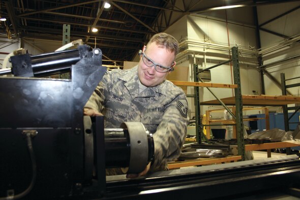 WRIGHT-PATTERSON AIR FORCE BASE, Ohio - Master Sgt. Josef Taylor, 445th Maintenance Group aircraft quality assurance instructor, uses a hydraulic aircraft tubing repair machine. The machine bends tubing in many different ways. (U.S. Air Force photo/Ken LaRock)